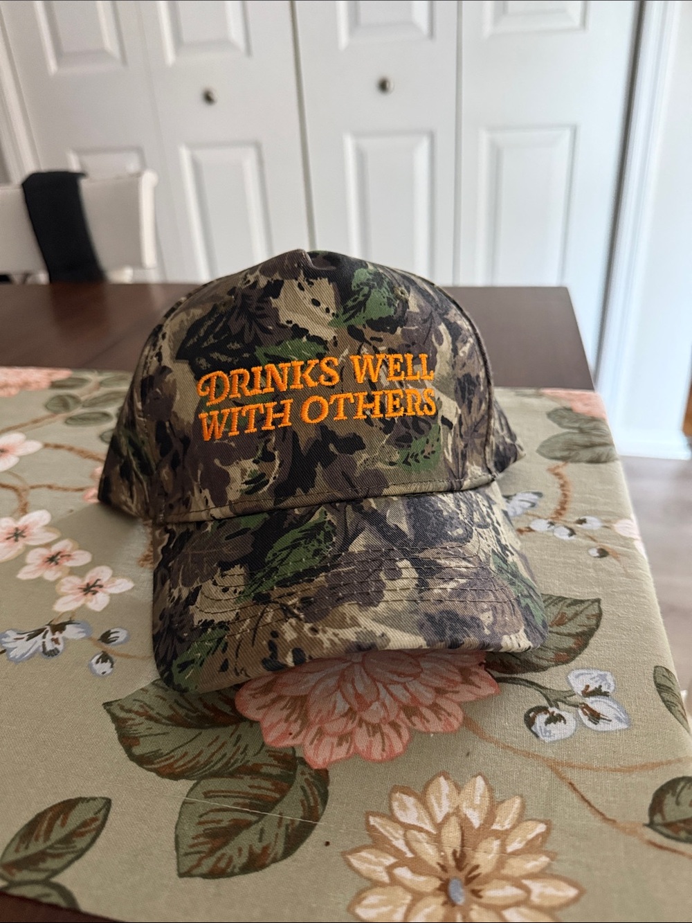 Camo Baseball Cap with Orange Embroidery - "Drinks Well With Others"